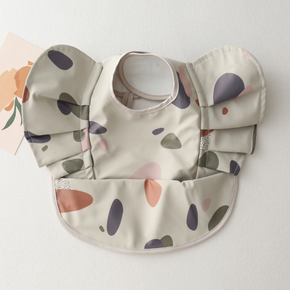 Baby bib neutral for boys and girls with pebbles