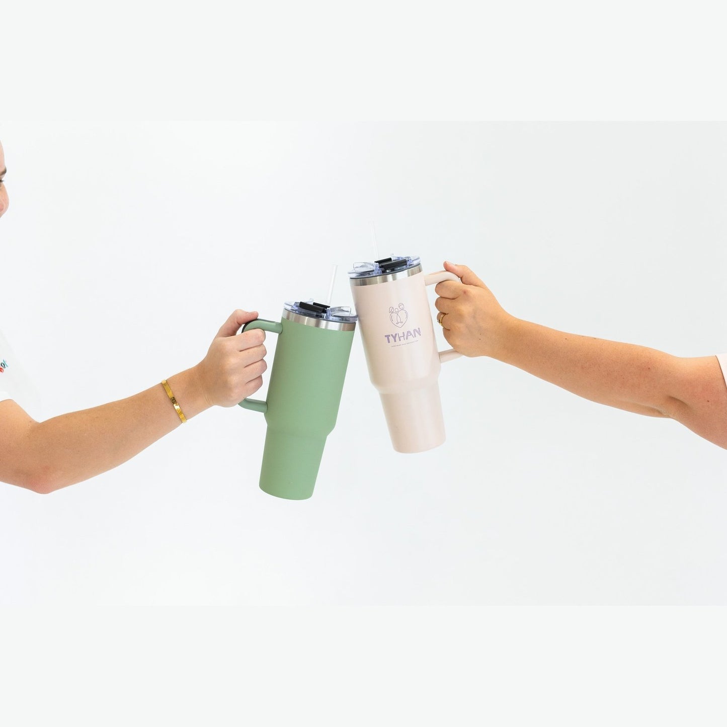 Image of two mums with their insulated drink bottle that has mum mantras engraved on them