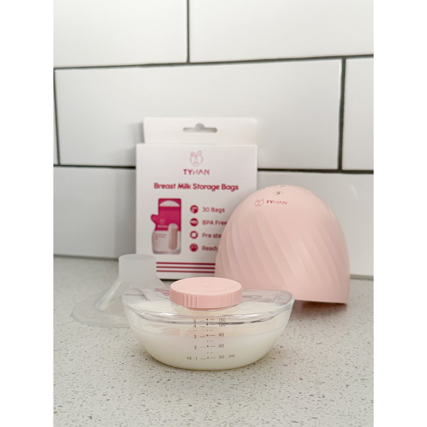 The breastmilk collected from a mum after using the Tyhan wearable breast pump showing how convenient the collection cup is that can be turned into storage container