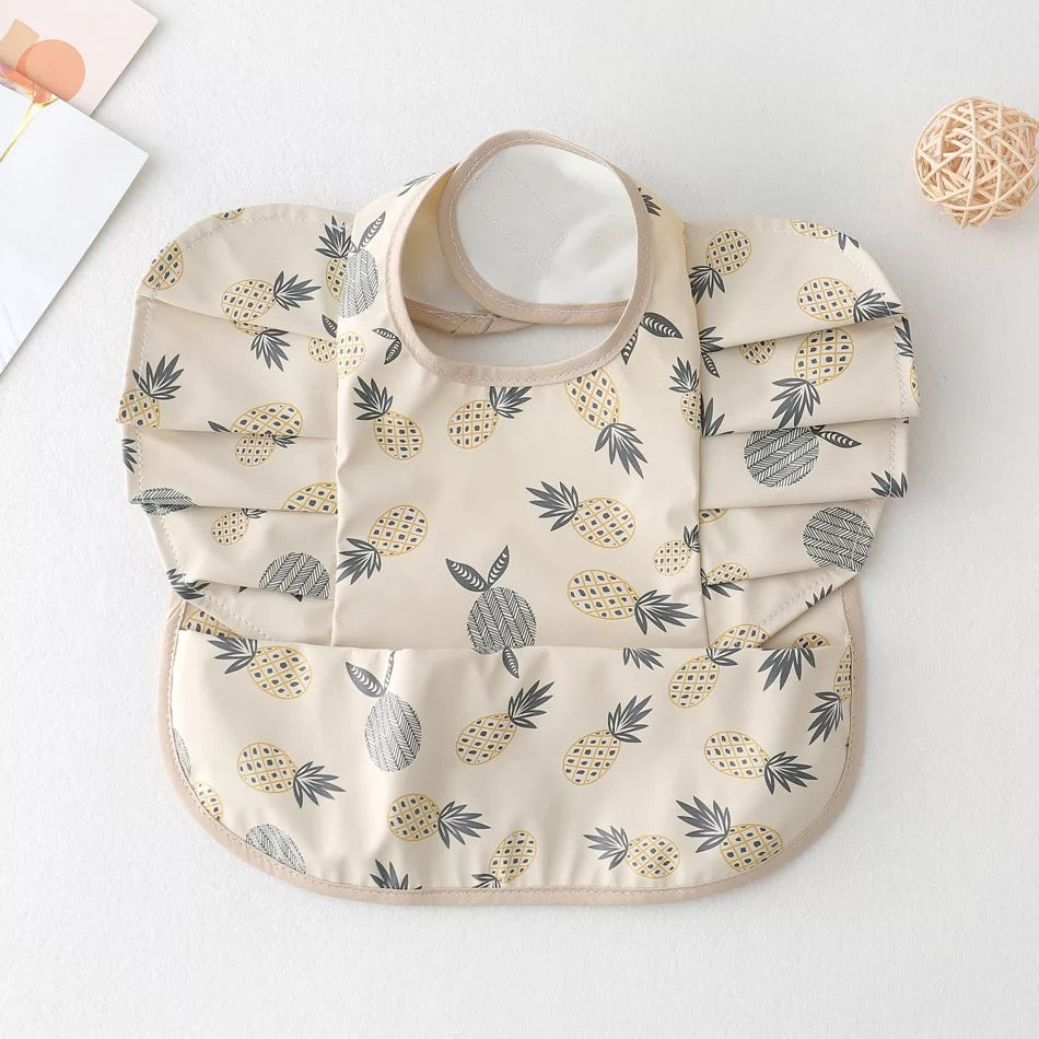 Adjustable baby bib for all ages that is easy to clean and wash.