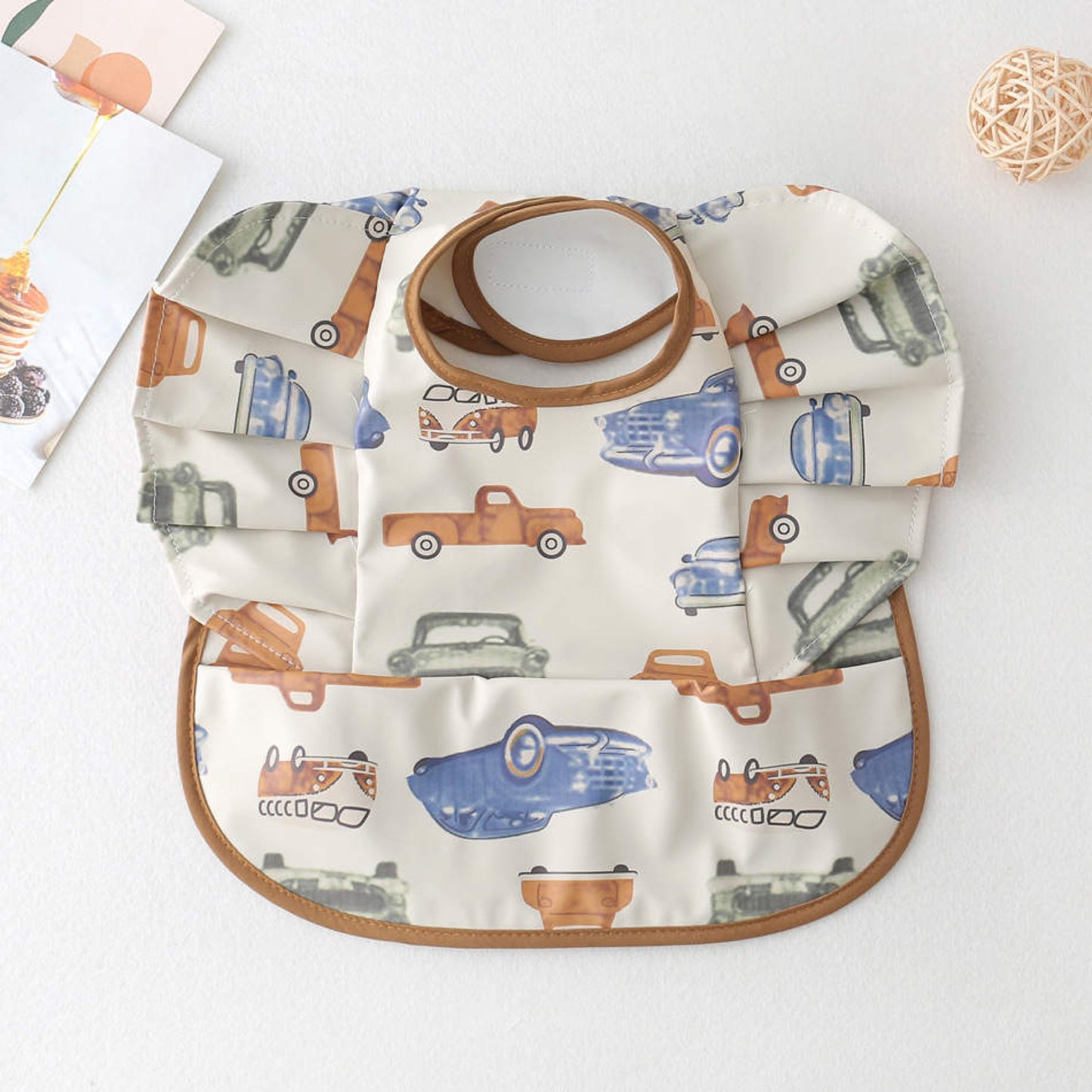 Adjustable baby bib in a car desugb for all ages that is easy to clean and wash.